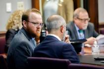 Travis McMichael, left, speaks with his attorney Jason B. Sheffield , center, during his senten ...