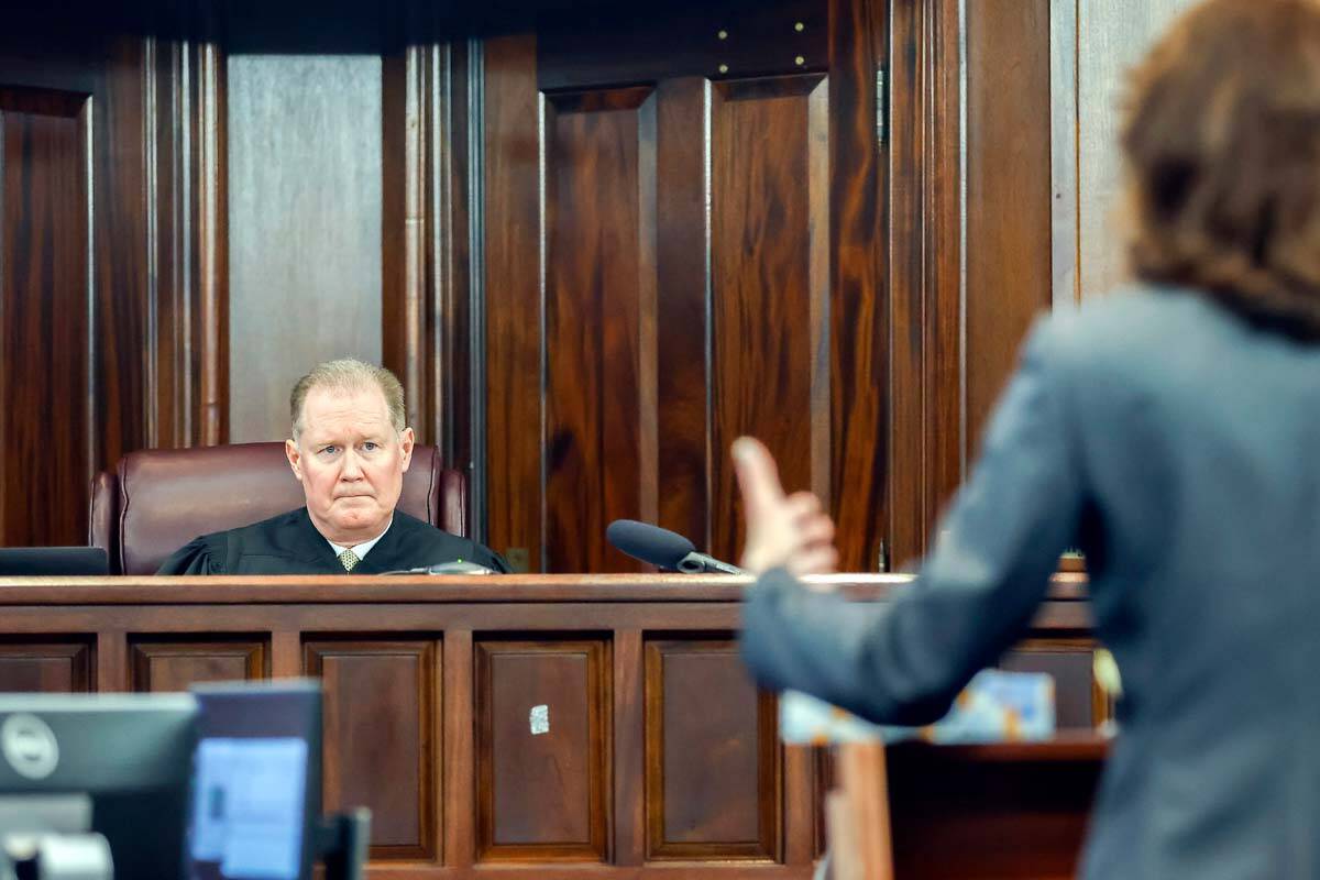 Superior Court Judge Timothy Walmsley, left, listens to prosecutor Linda Dunikoski's opening st ...