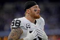 Raiders defensive end Maxx Crosby (98) stands on the sideline during the first half of an NFL f ...