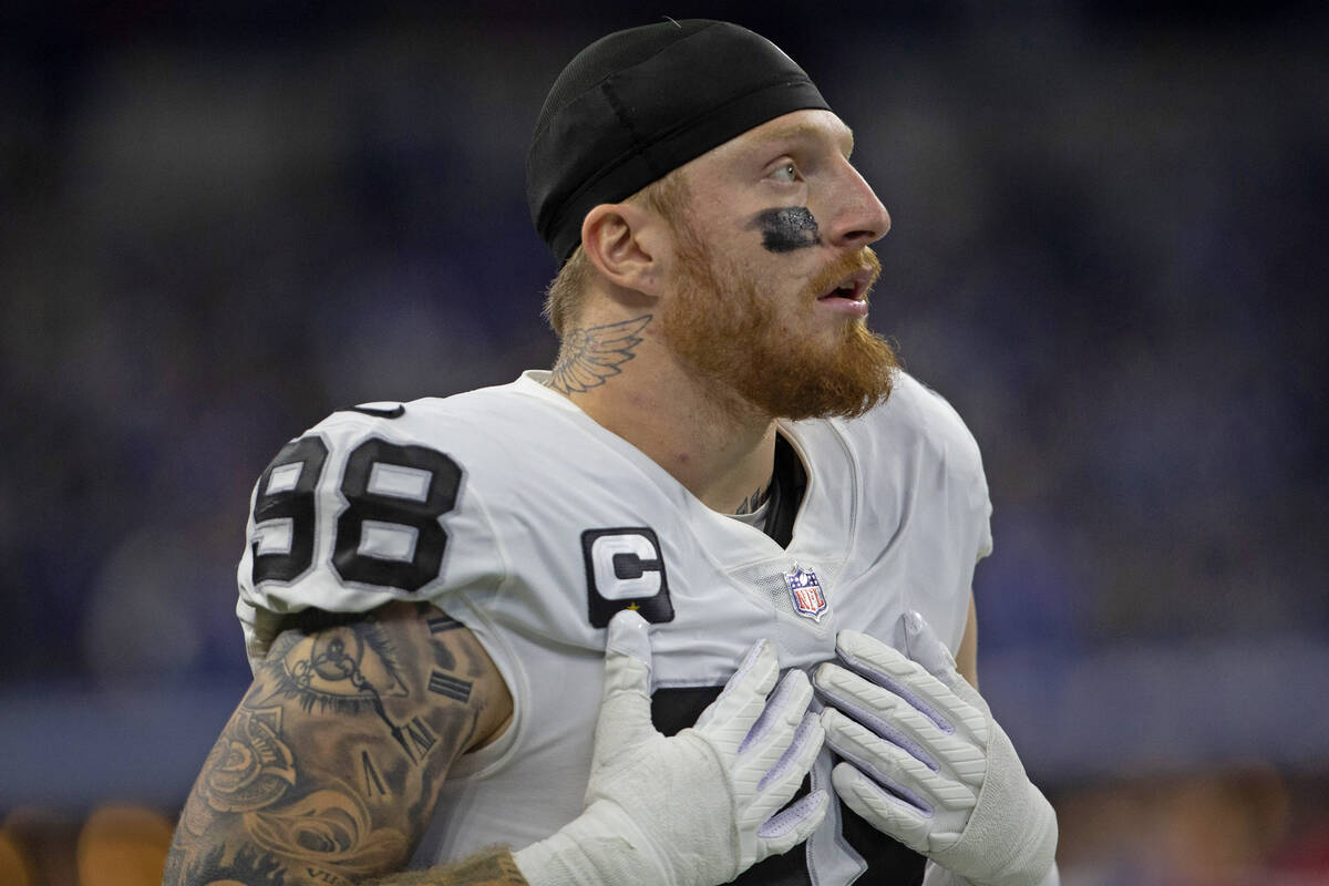 Raiders defensive end Maxx Crosby (98) stands on the sideline during the first half of an NFL f ...