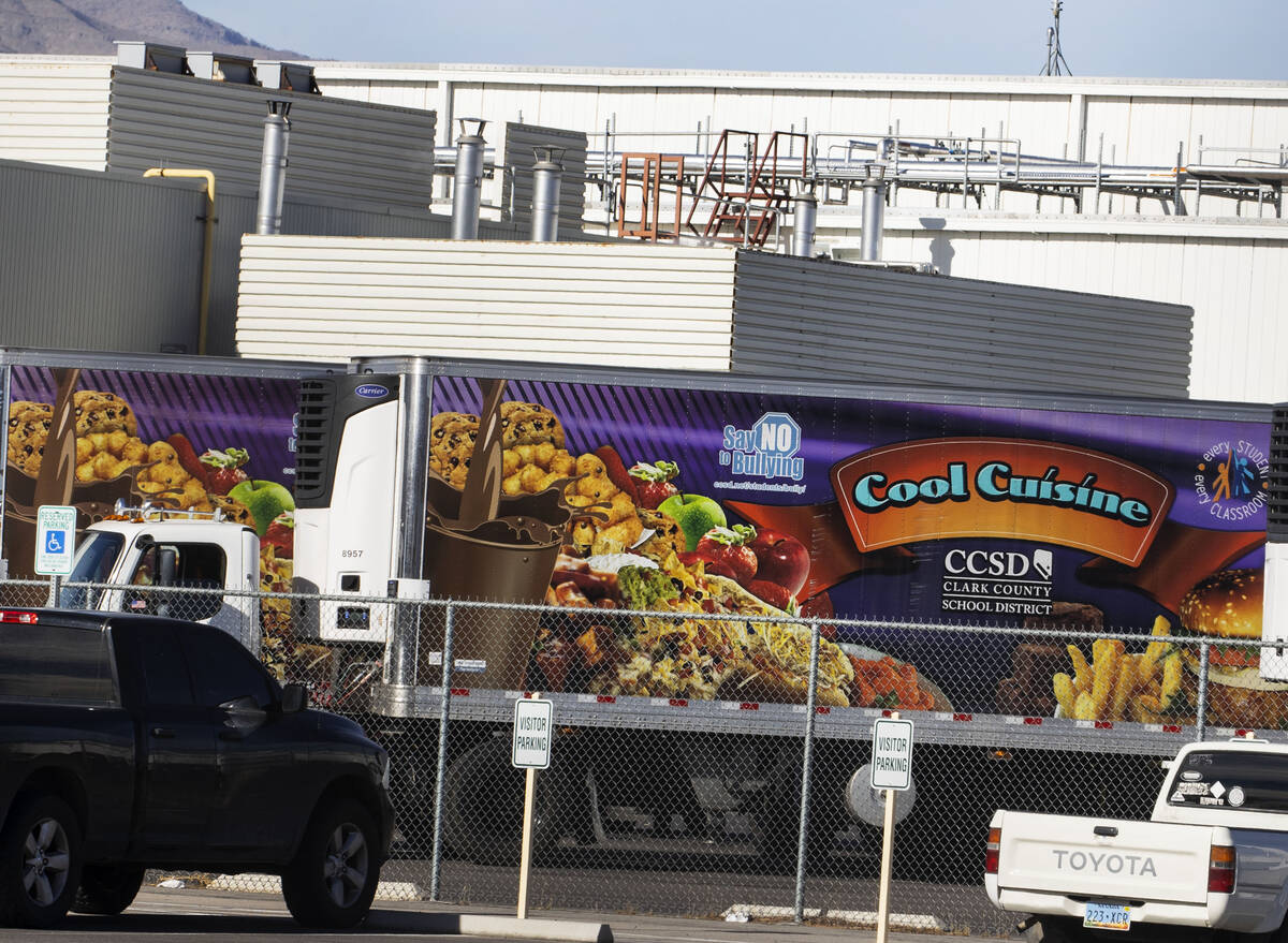 Food delivery trucks are parked outside of the Clark County School District food service facili ...