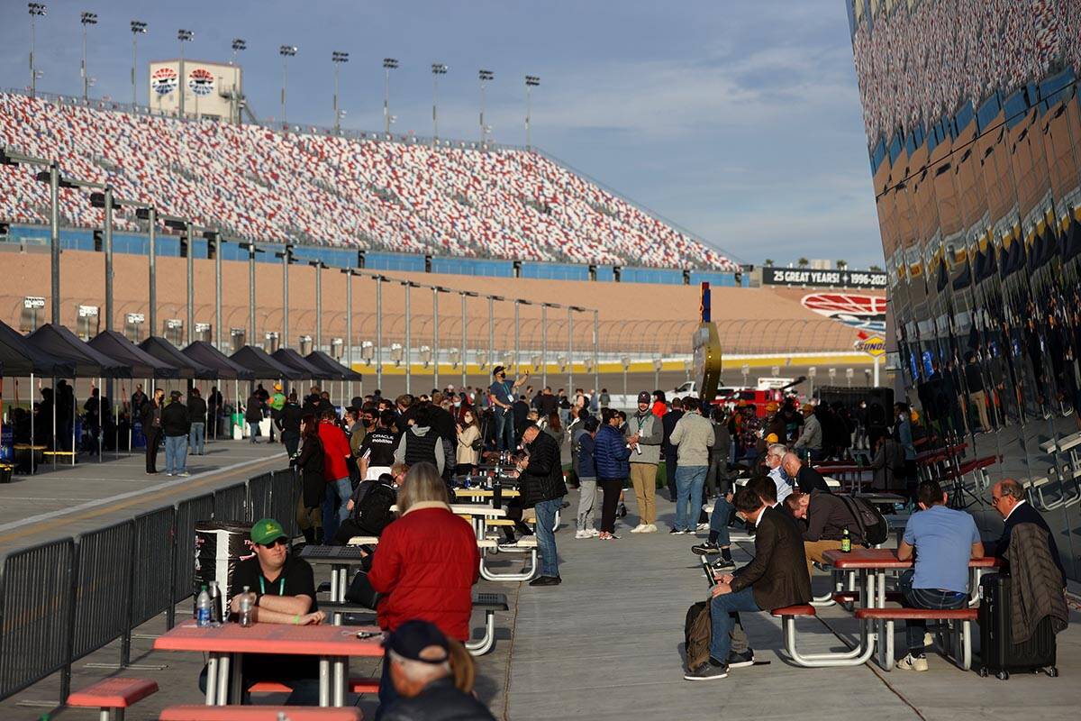 Spectators watch autonomous vehicles race during the Indy Autonomous Challenge at the Las Vegas ...