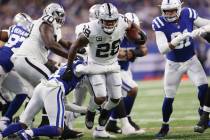 Raiders running back Josh Jacobs (28) runs the ball against the Indianapolis Colts in the first ...