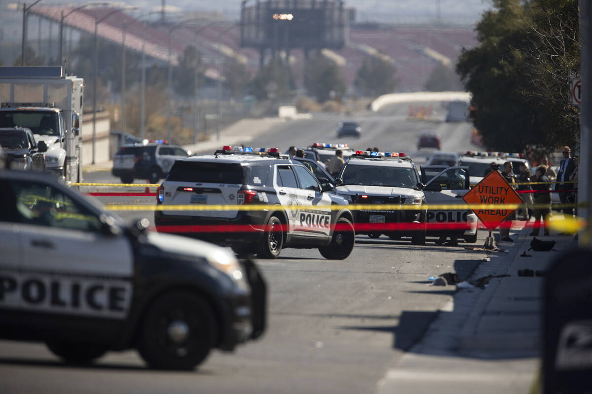 Las Vegas police investigate the scene of an officer-involved shooting near the intersection of ...