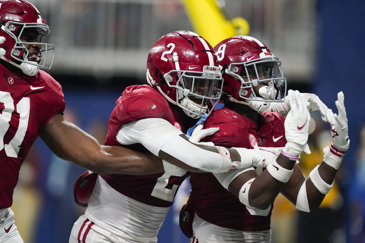 Alabama defensive back Jordan Battle (9) celebrates his interception and touchdown against Geor ...