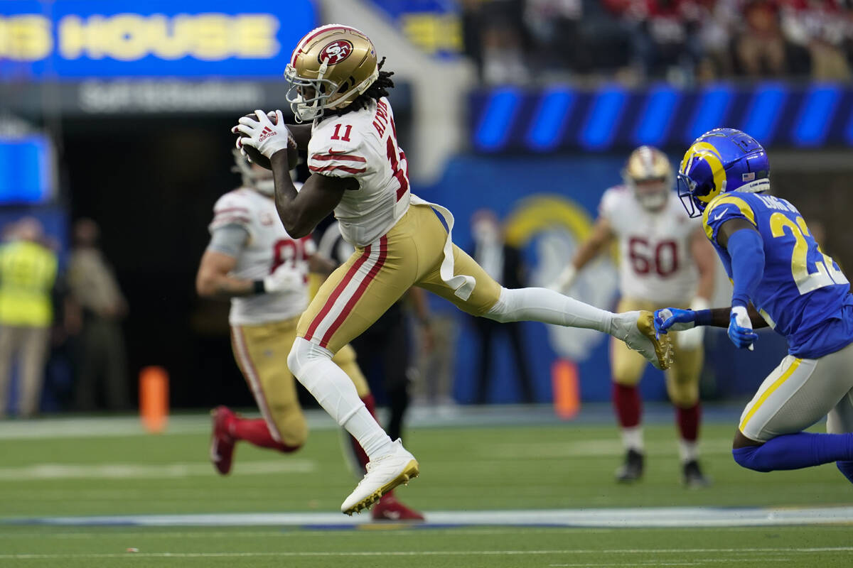 San Francisco 49ers wide receiver Brandon Aiyuk (11) catches a pass during the first half of an ...