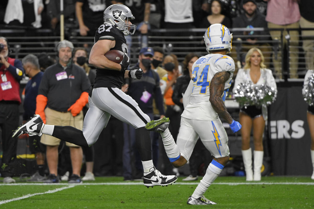 Las Vegas Raiders tight end Foster Moreau (87) runs after making a catch against the Los Angele ...