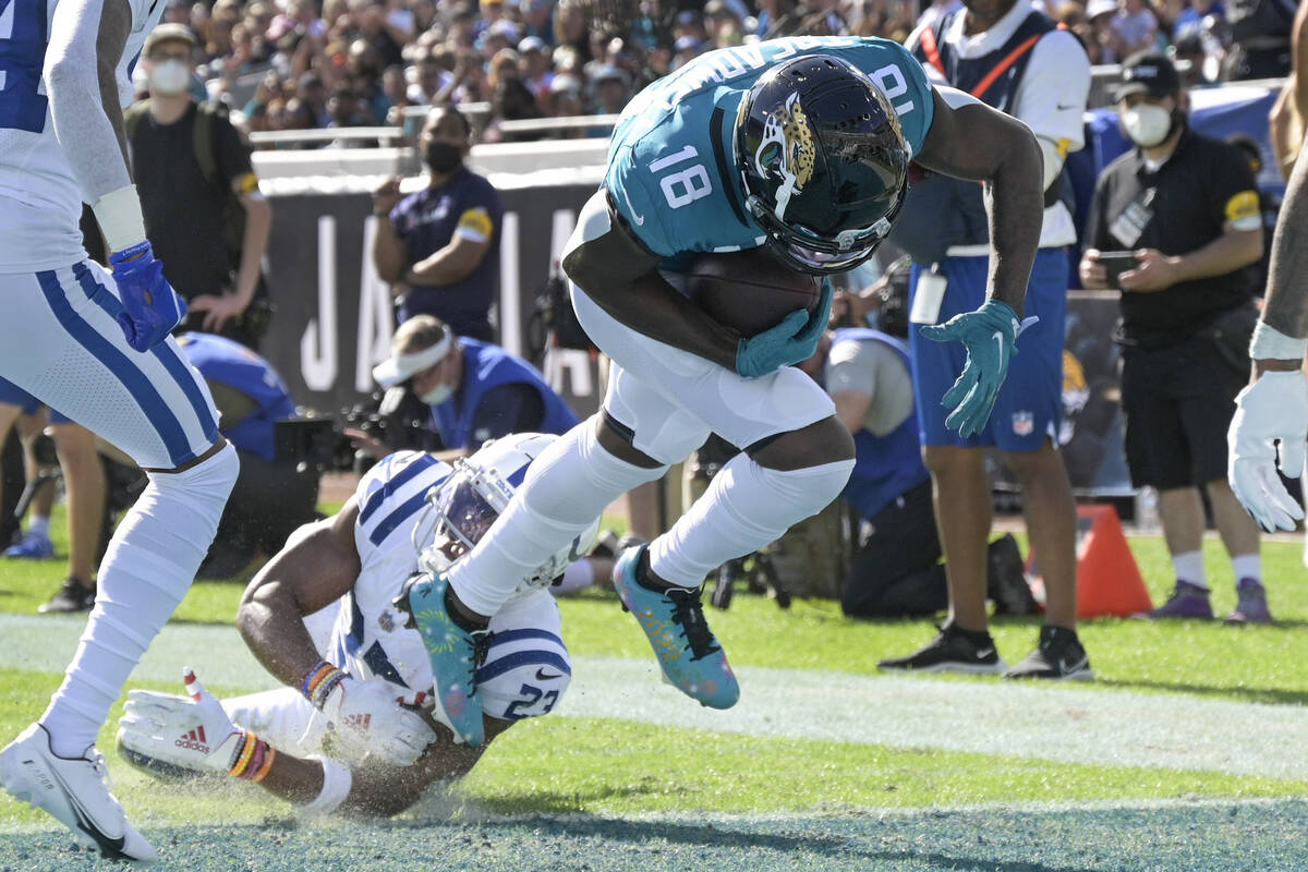 Jacksonville Jaguars wide receiver Laquon Treadwell (18) slips past Indianapolis Colts cornerba ...