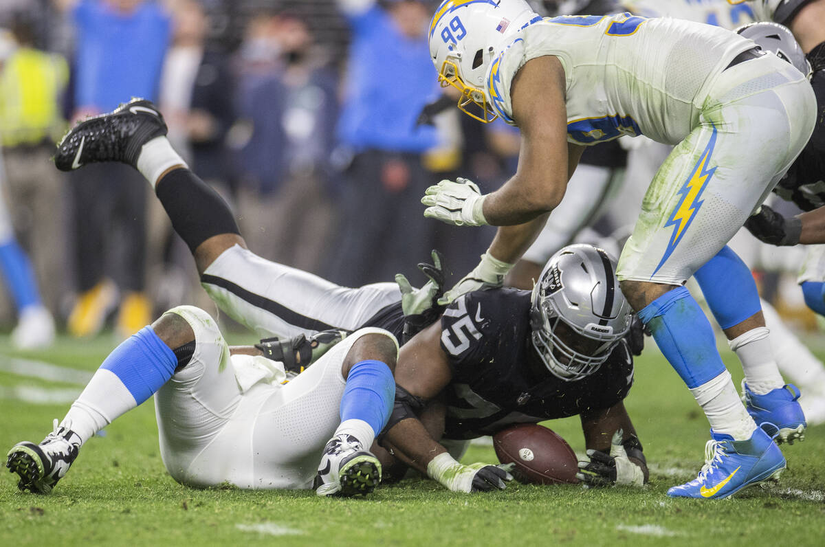 Raiders offensive tackle Brandon Parker (75) dives to try and recover a fumble with Los Angeles ...
