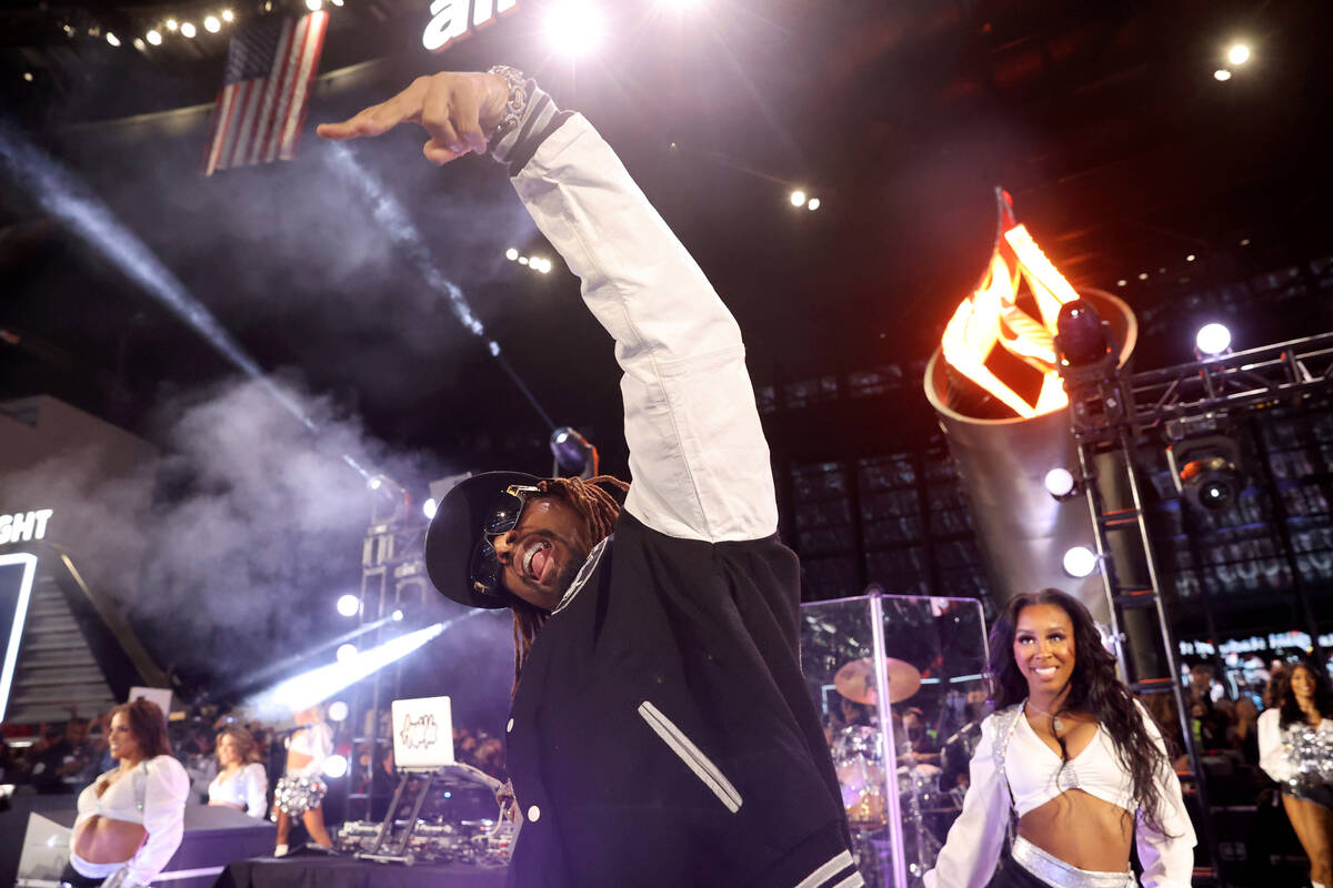 Lil Jon performs with members of the Raiderettes during halftime as the Raiders take on the Los ...