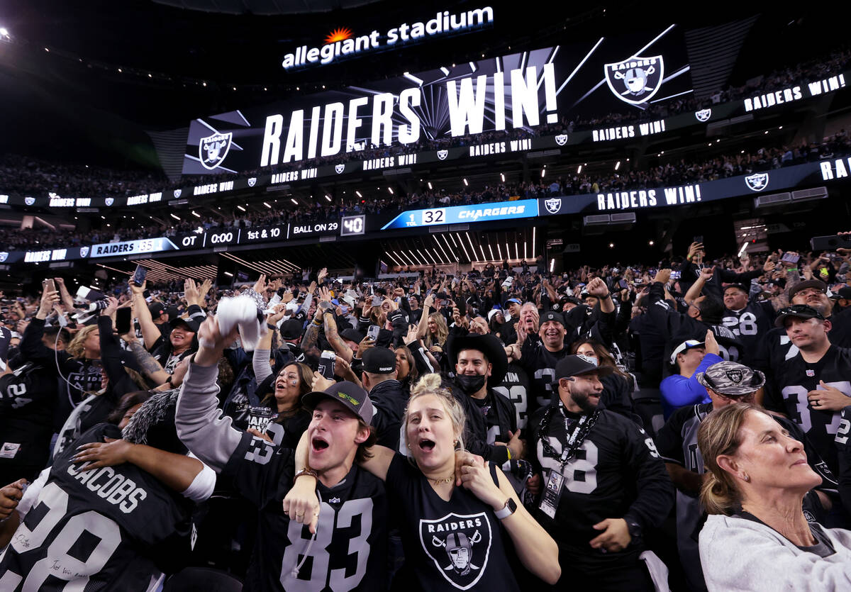 Fans, including Jack Wright, of Fresno, Calif. and Emma Stewart of Turlock Calif., celebrate Ra ...