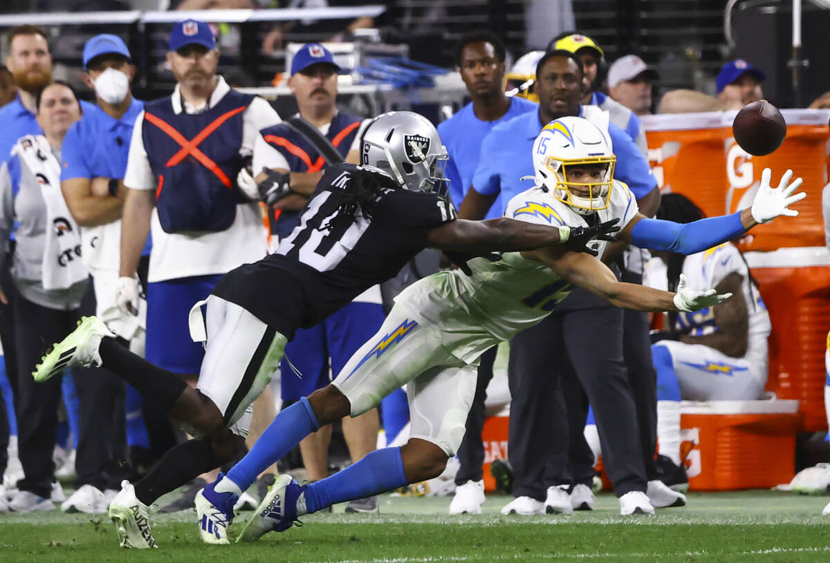 Raiders cornerback Desmond Trufant (10) breaks up a pass intended for Los Angeles Chargers wide ...