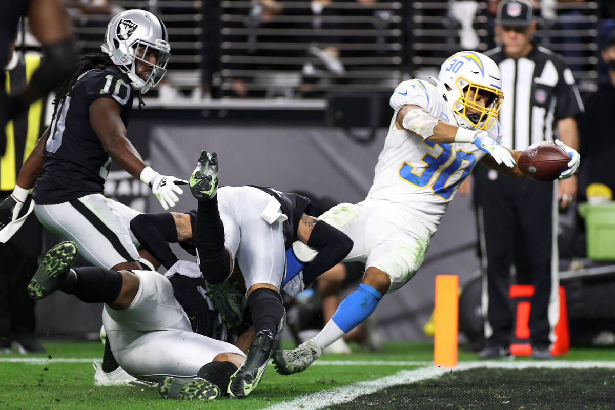 Los Angeles Chargers running back Austin Ekeler (30) dives for a touchdown in the first half of ...