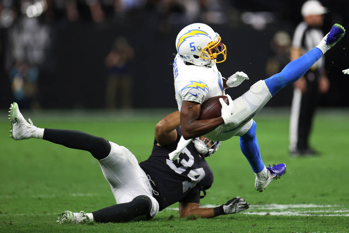 Raiders cornerback Brandon Facyson (35) tackles Los Angeles Chargers wide receiver Josh Palmer ...