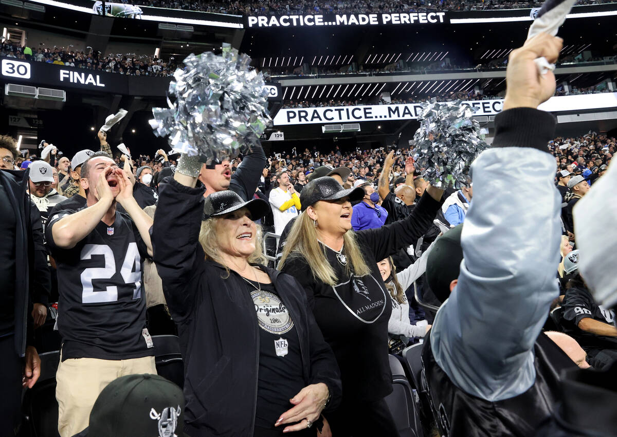 Former Raiderettes Sandy Humphers Denney 1961-1963, left, and Denise Villanueva 1984-1992, chee ...