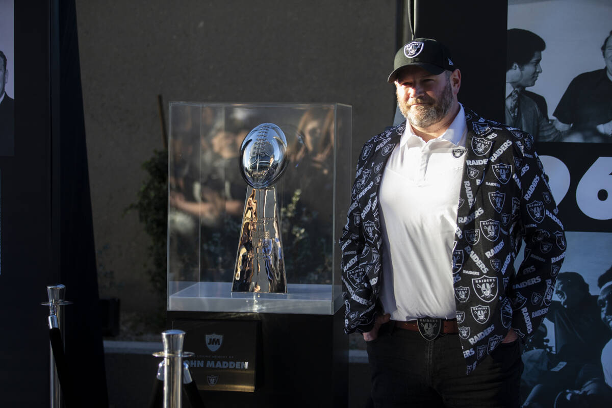 Chris Gemmill takes a photo with the Vince Lombardi Trophy displayed as part as a John Madden m ...