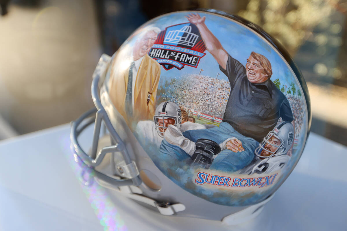 A John Madden themed helmet is displayed as part of a gallery outside of Allegiant Stadium in L ...