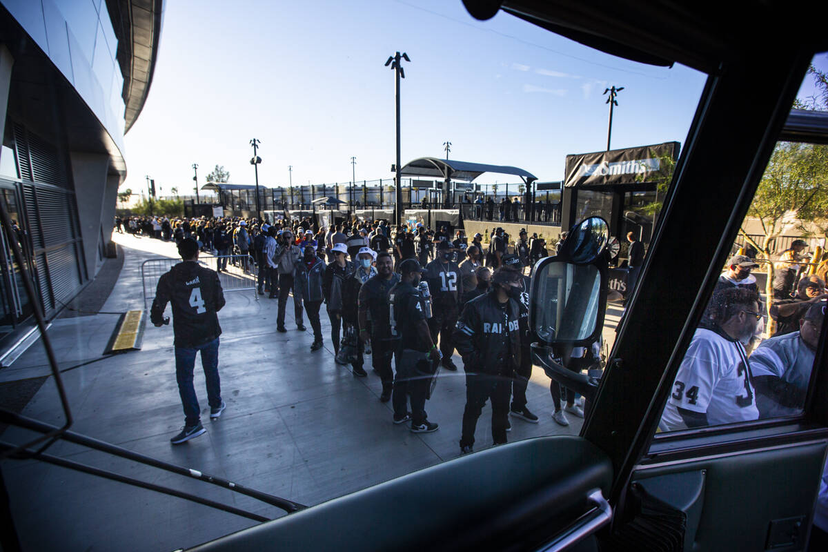 Fans line up to see the famed Madden Cruiser before the start of an NFL football game against t ...