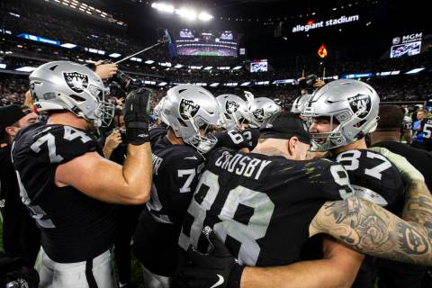 The Raiders celebrate after the team’s overtime win against the Los Angeles Chargers in ...