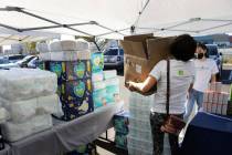 Ceylan Ozdemir left, and, Ciara Garden, both volunteers from Lincoln Dynamic Foundation, displa ...