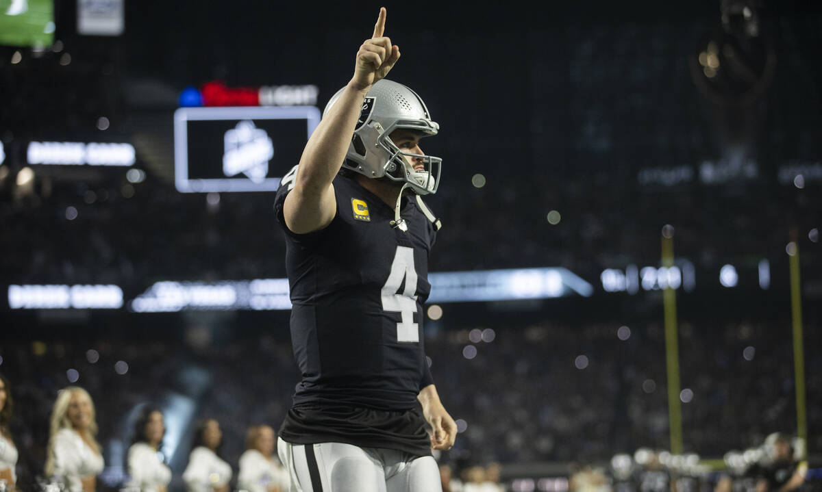 Raiders quarterback Derek Carr (4) is introduced before the start of an NFL football game again ...