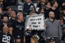 A Raiders fan holds up a sign during the second half of an NFL football game against the Los An ...