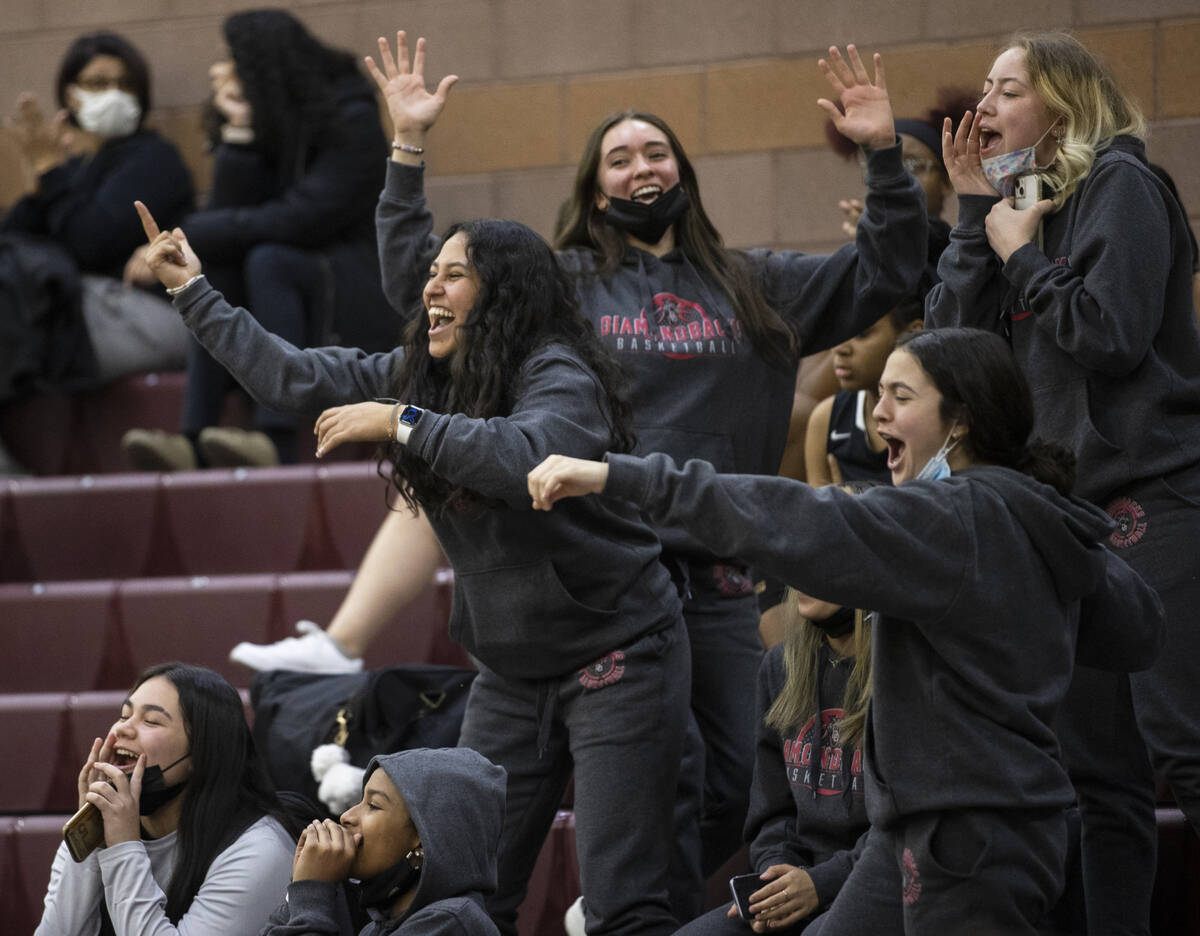 Fans cheer for Desert Oasis successful  the 3rd  4th   during a girls precocious   schoolhouse  hoops  crippled  aga ...