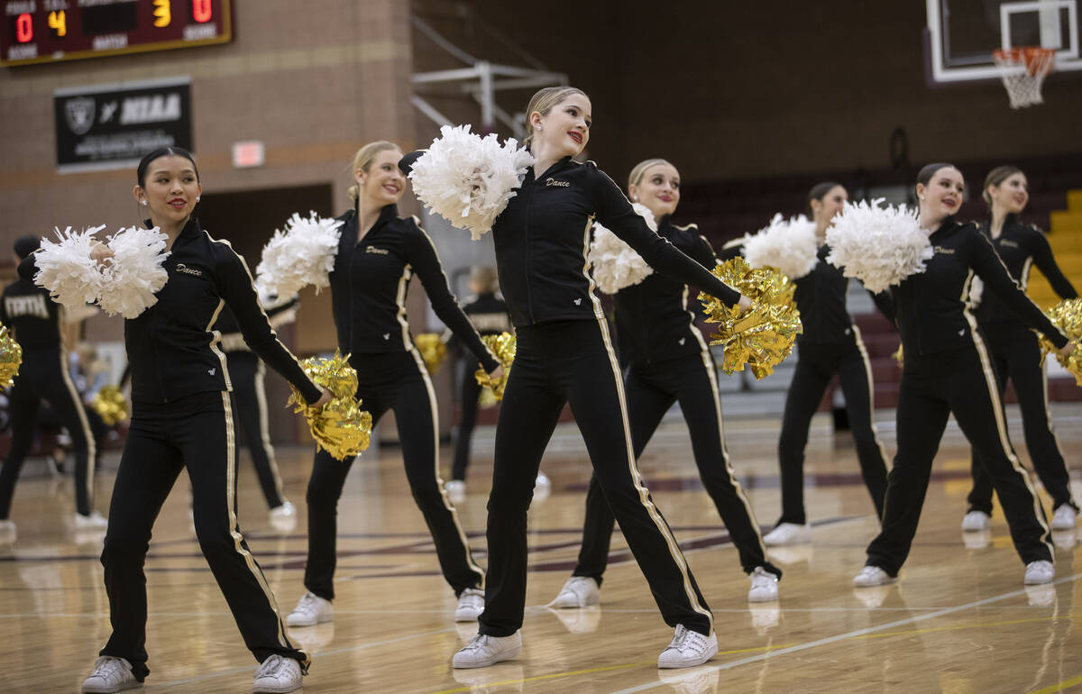 The Desert Oasis creation   squad  performs astatine  halftime during a girls precocious   schoolhouse  hoops  crippled  aga ...
