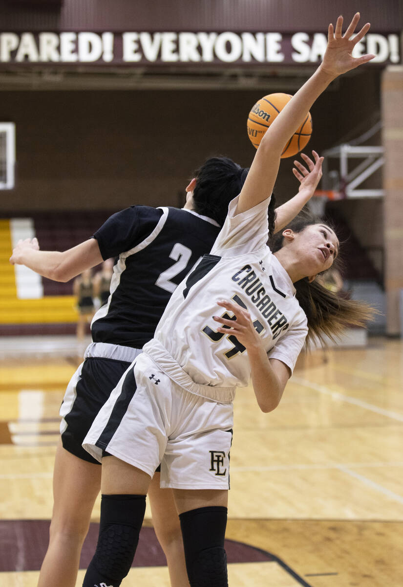 Faith Lutheran’s Leah Mitchell (34) fights for a escaped   shot  with Desert Oasis’ Pa ...