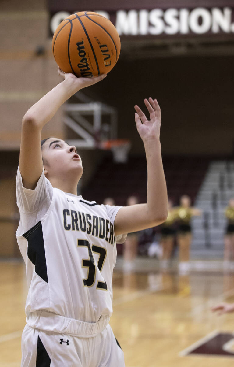 Faith Lutheran’s Emma Herpin (33) drives to the rim successful  the archetypal  4th   during a girls ...