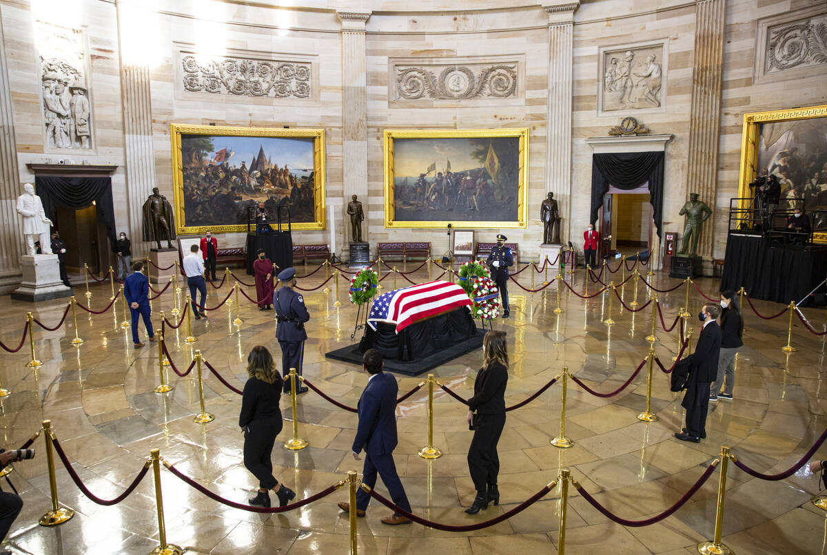 People pay their respects while viewing the flag-draped casket of former Sen. Harry Reid as he ...