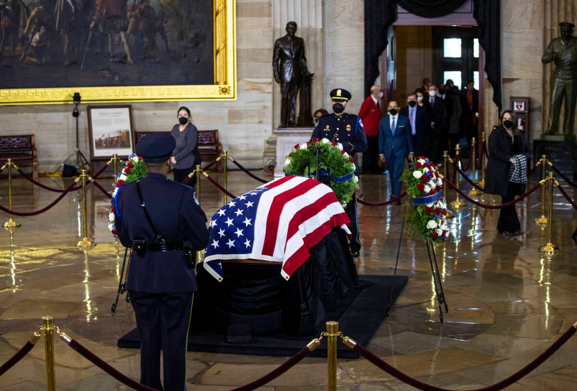 People pay their respects while viewing the flag-draped casket of former Sen. Harry Reid as he ...