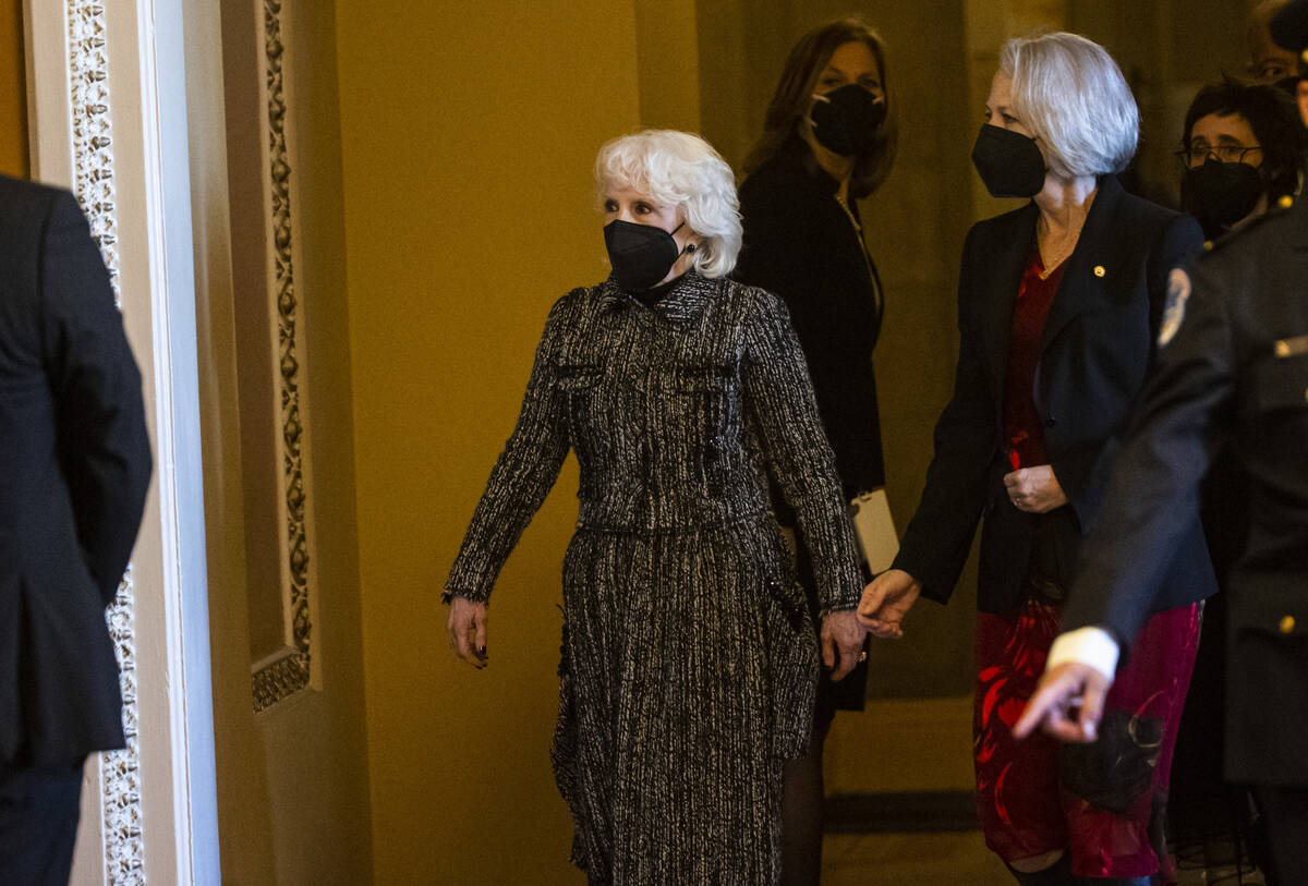 Landra Reid departs from the Rotunda of the U.S. Capitol after a memorial service for her husba ...