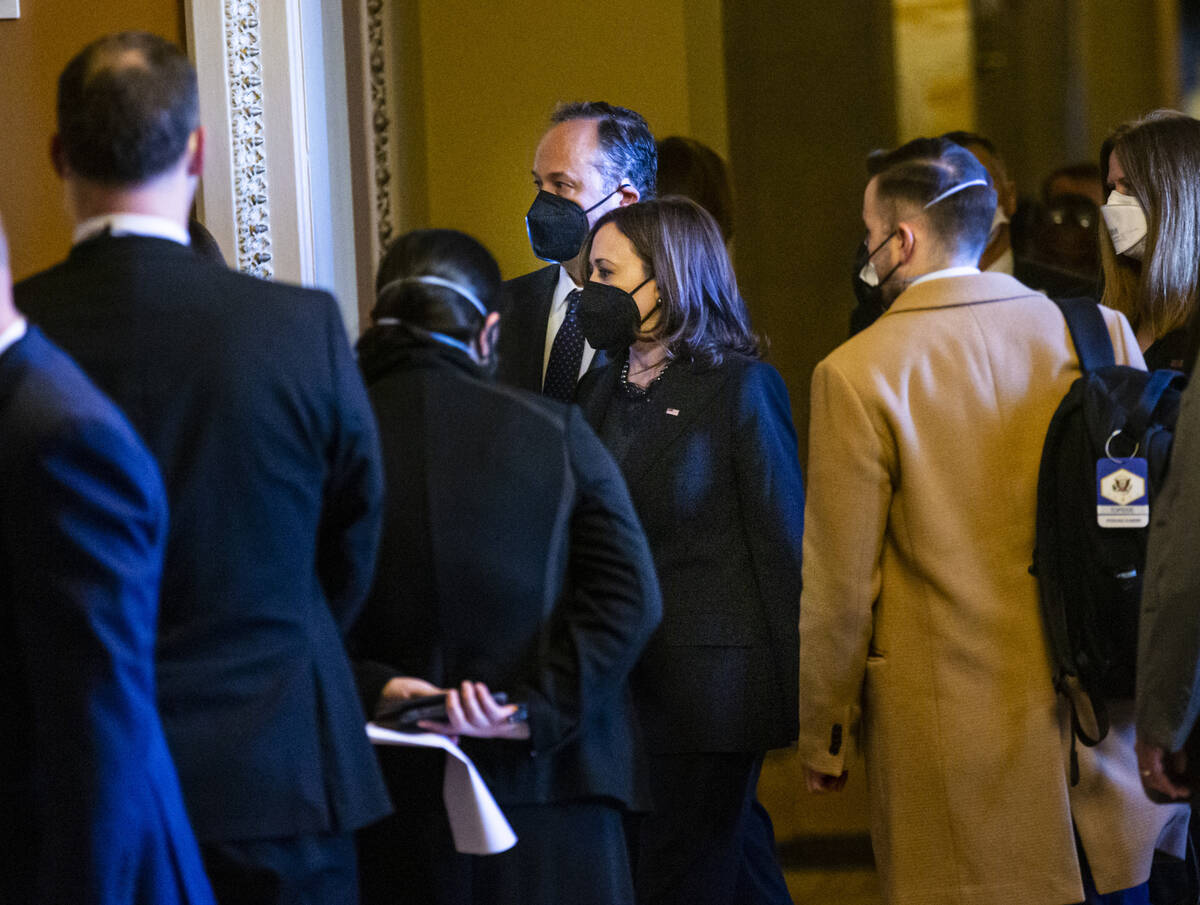 Vice President Kamala Harris and Second gentleman Doug Emhoff make their way to a room to visit ...