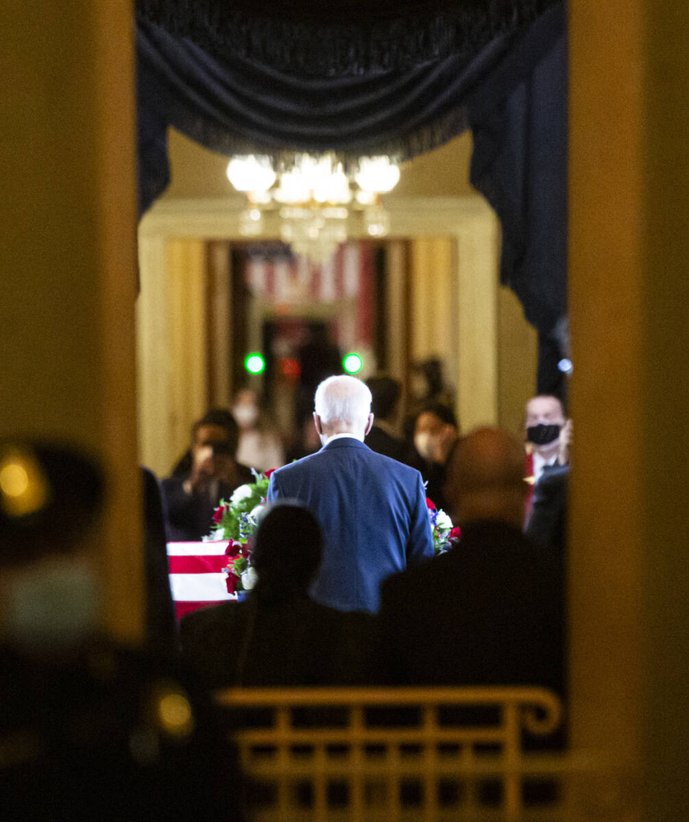 President Joe Biden enters the Rotunda to pay respects to former U.S. Sen. Harry Reid as he li ...