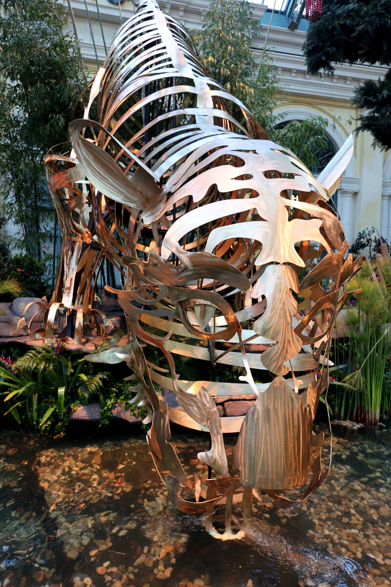 A bronze tiger sculpture takes a sip of water in the Lunar New Year display at Bellagio Conserv ...