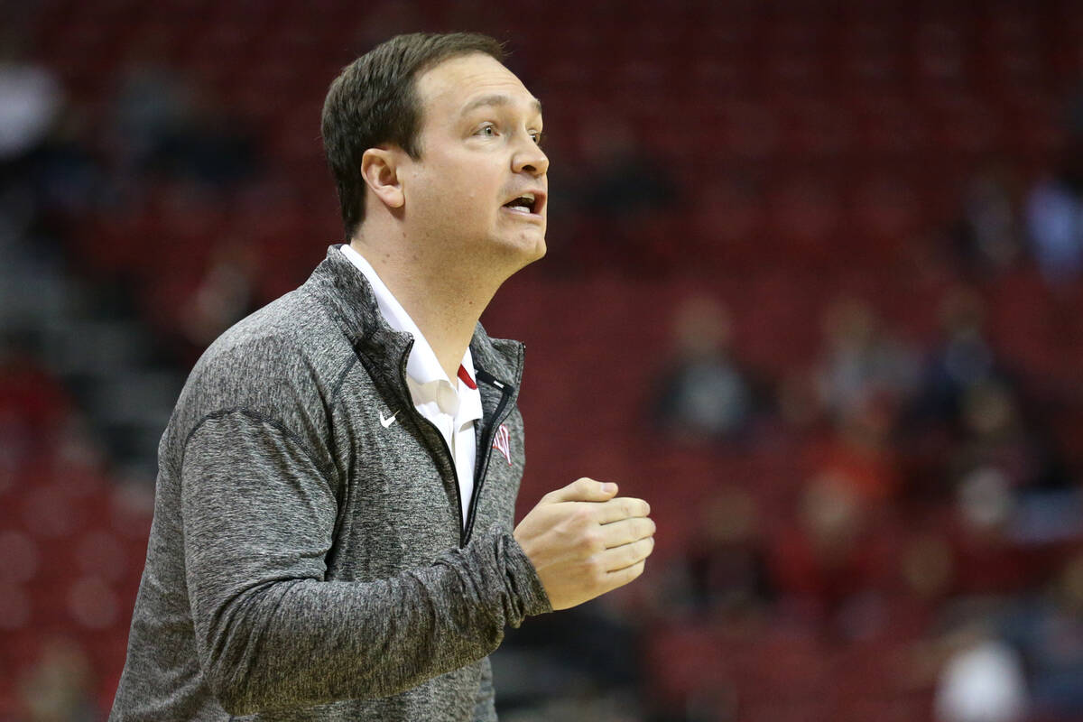 UNLV Rebels head coach Kevin Kruger shouts from he sidelines during the first half of an NCAA c ...