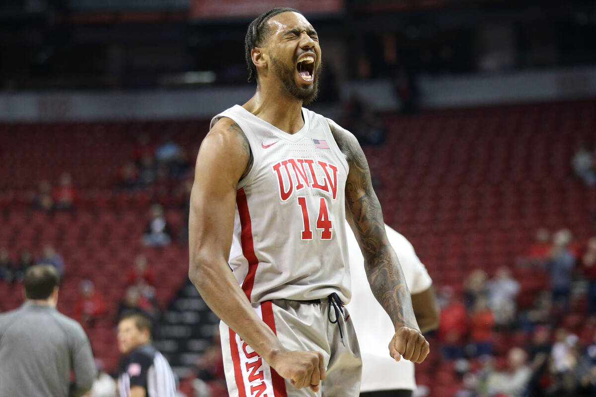 UNLV Rebels forward Royce Hamm Jr. (14) celebrates after scoring against the New Mexico Lobos d ...