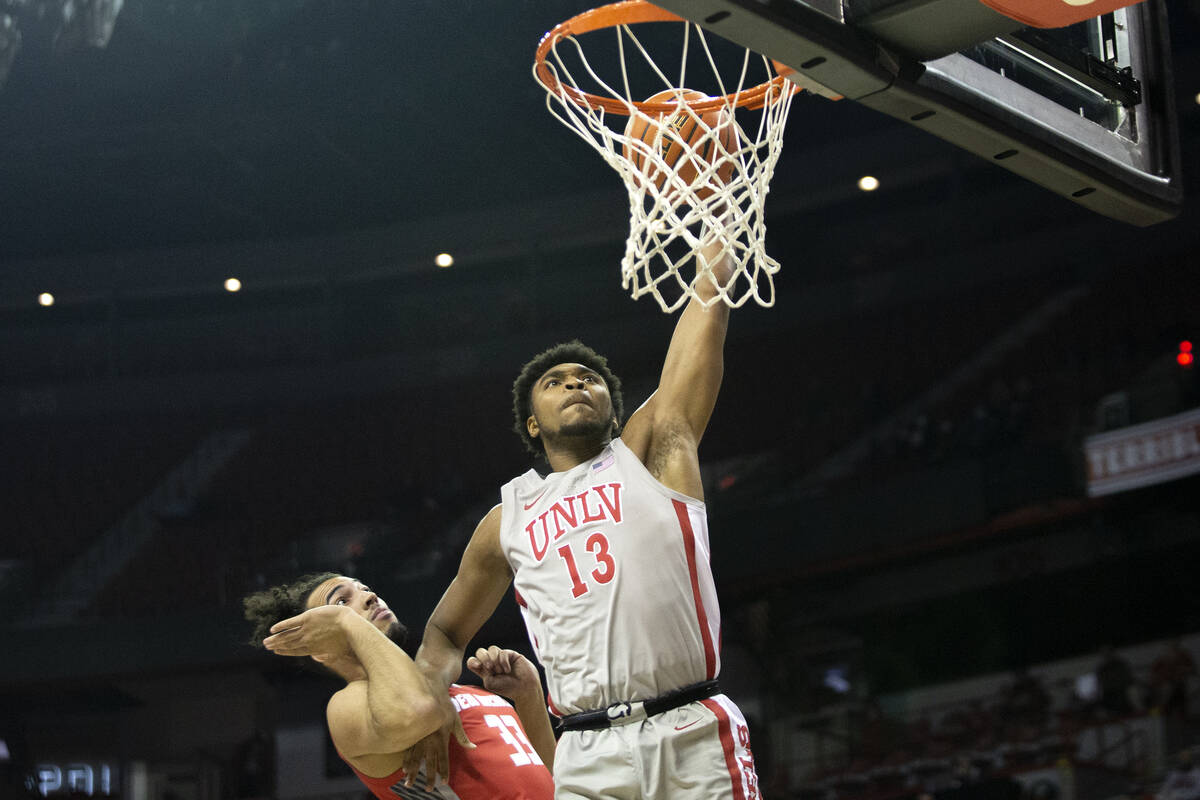 UNLV Rebels guard Bryce Hamilton (13) dunks against New Mexico Lobos forward Jordan Arroyo (33) ...