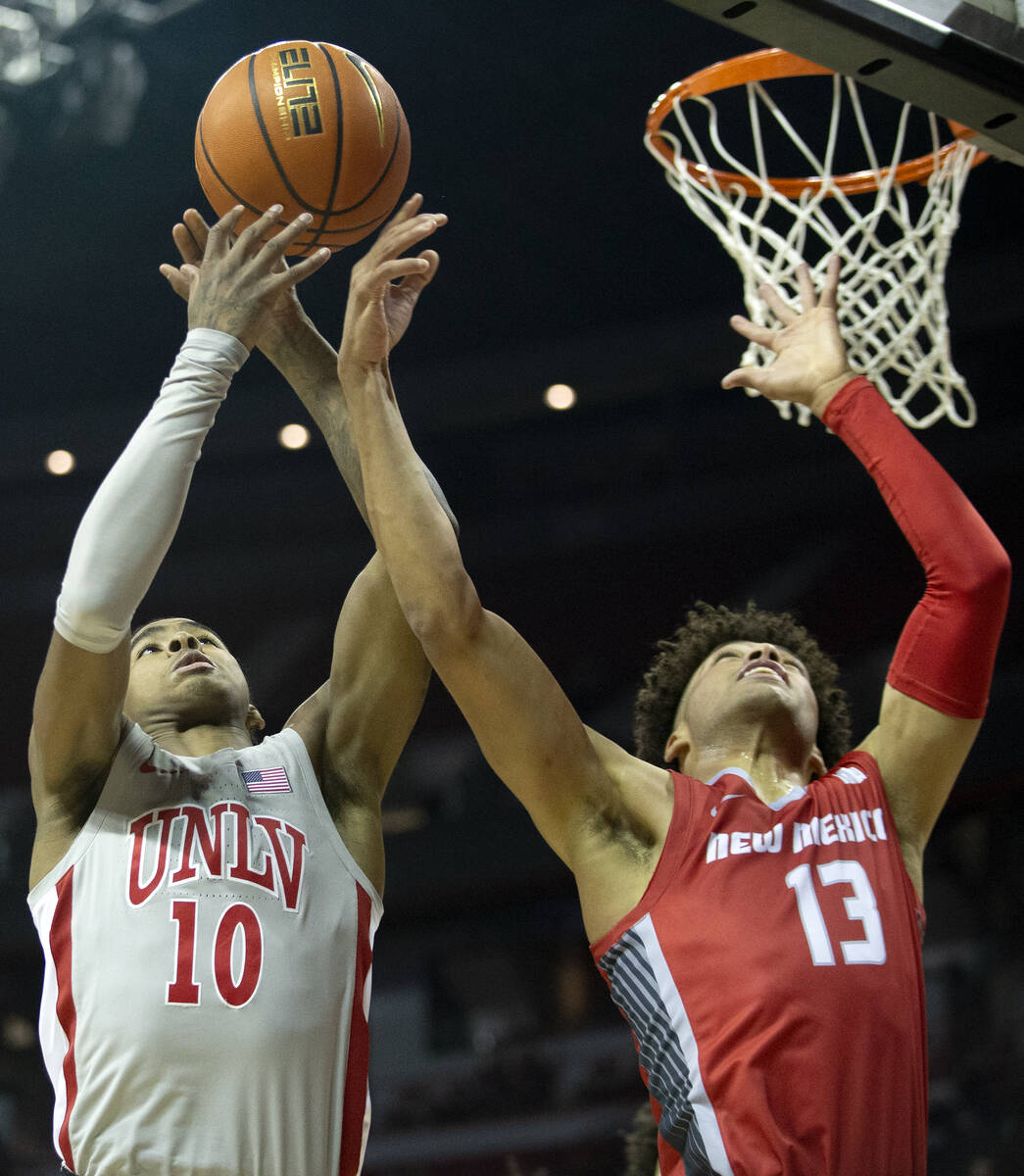 UNLV Rebels guard Keshon Gilbert (10) shoots against New Mexico Lobos guard Javonte Johnson (13 ...