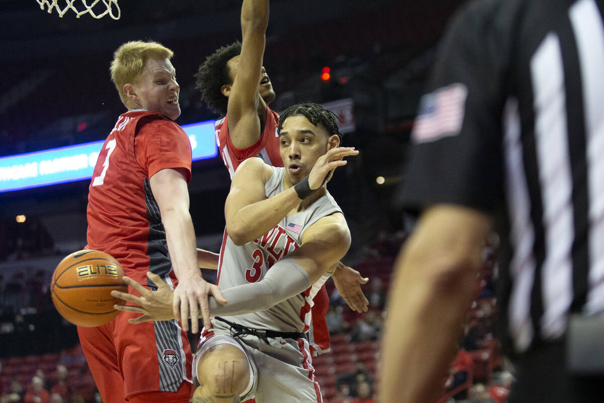 UNLV Rebels guard Marvin Coleman (31) passes down the court while New Mexico Lobos center Sebas ...