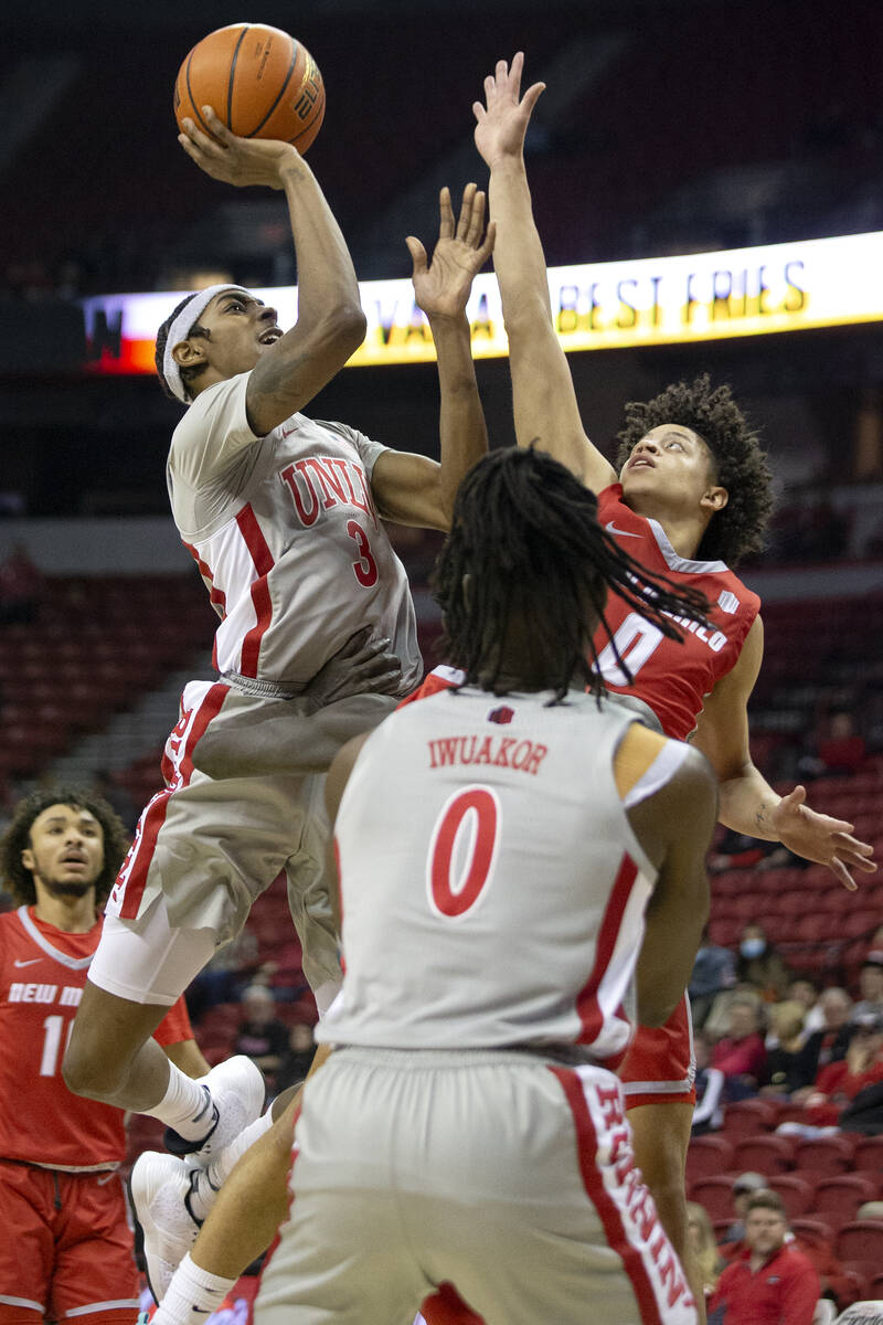 UNLV Rebels forward Donovan Williams (3) shoots against New Mexico Lobos guard KJ Jenkins (0) w ...