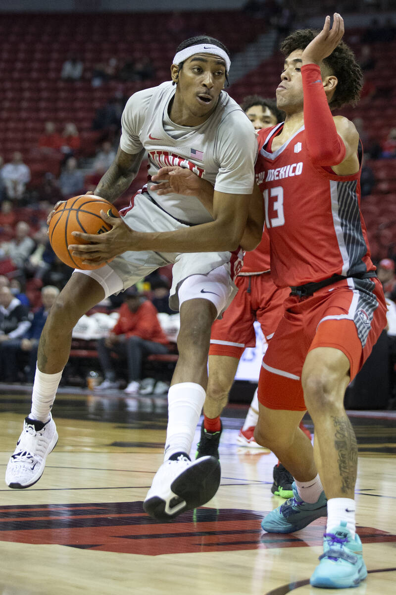 UNLV Rebels forward Donovan Williams (3) shoots against New Mexico Lobos guard Javonte Johnson ...