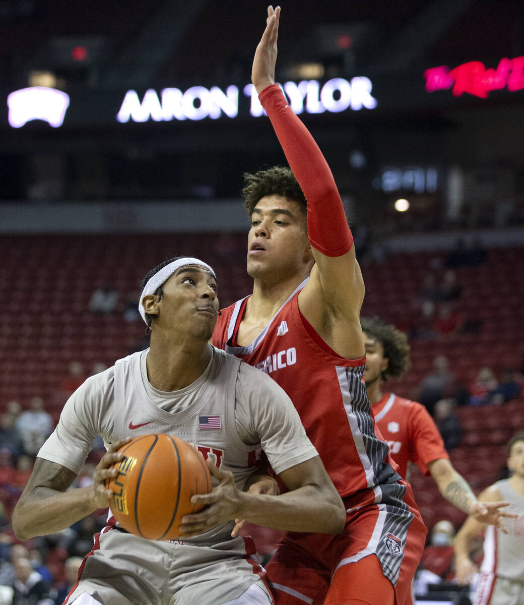 UNLV Rebels forward Donovan Williams (3) shoots against New Mexico Lobos guard Javonte Johnson ...