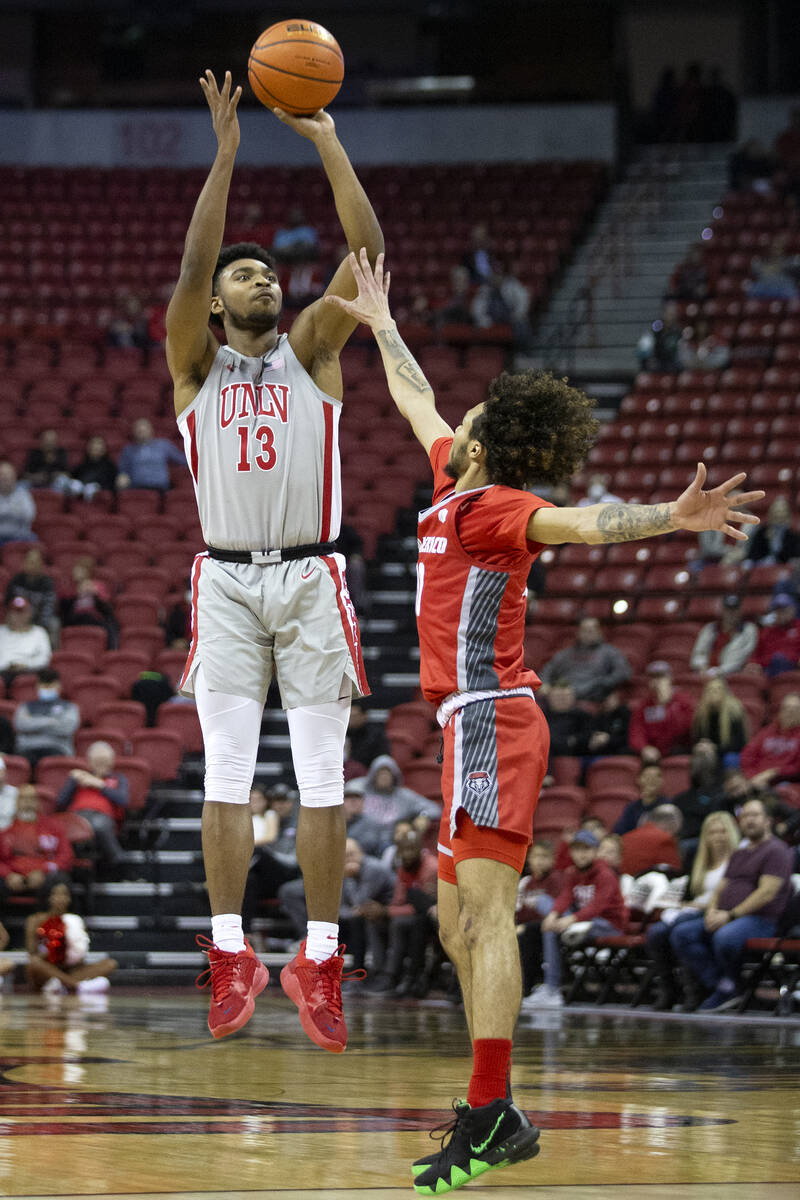 UNLV Rebels guard Bryce Hamilton (13) shoots against New Mexico Lobos forward Jordan Arroyo (33 ...