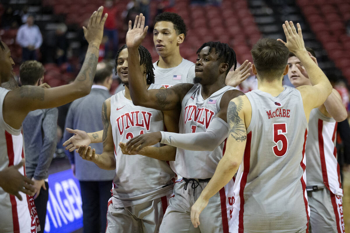 UNLV Rebels players including guard Cameron Burist (34), guard Michael Nuga (1) and guard Jorda ...
