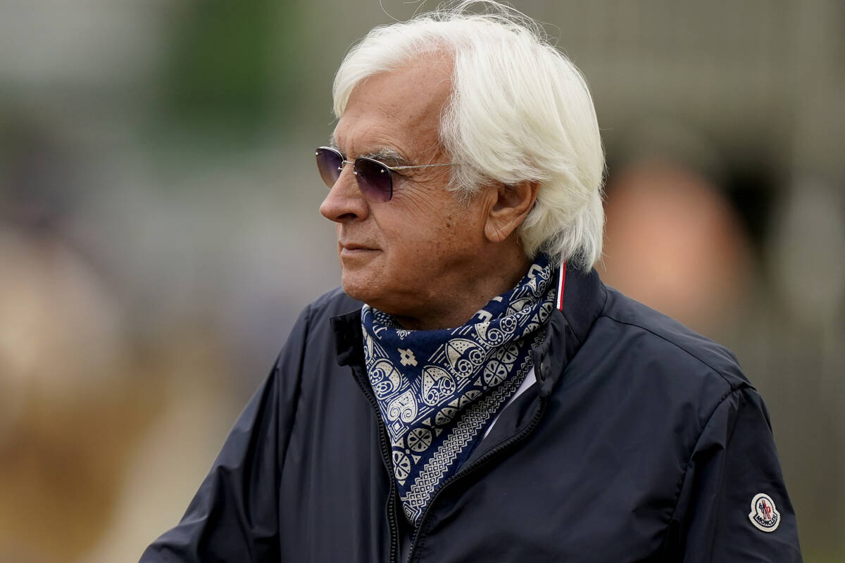 In this April 28, 2021, file photo, horse trainer Bob Baffert watches workouts at Churchill Dow ...