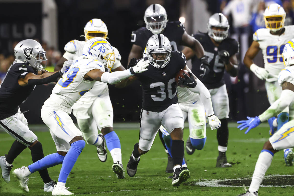 Raiders running back Jalen Richard (30) runs the ball against the Los Angeles Chargers during t ...