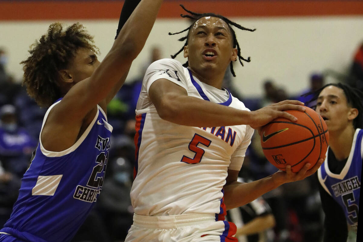 Bishop Gorman High School's Darrion Williams (5) shoots over Evangel Christian School's Christi ...