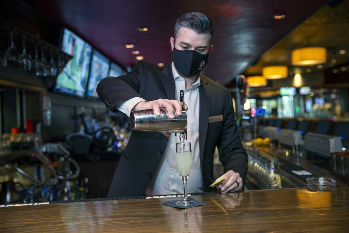 Director of Beverage Sam Pulliam pours a vintage cocktail ғage and the PineӠas the ...